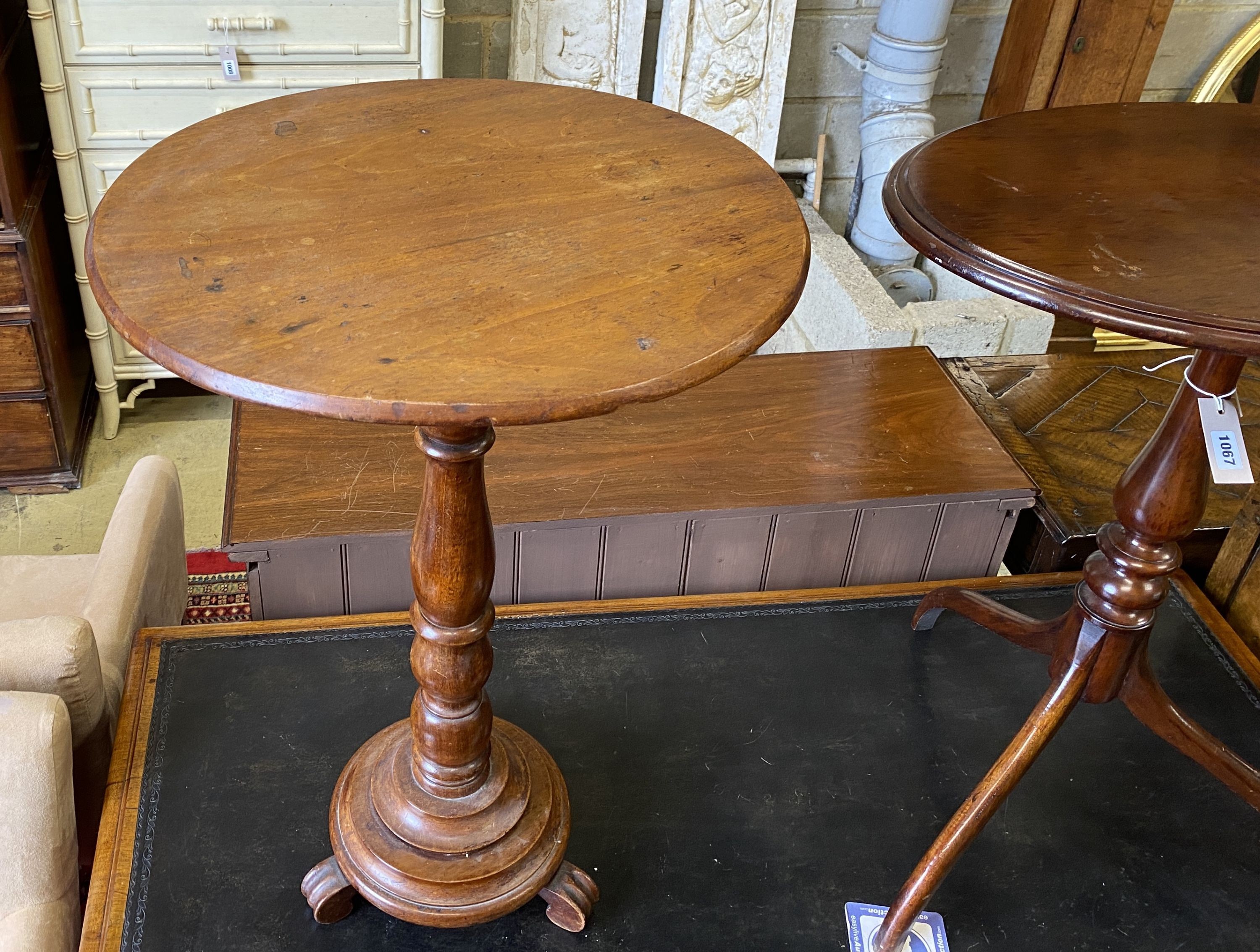 A Victorian circular mahogany wine table, diameter 50cm, height 76cm together with an oval tilt top tripod table